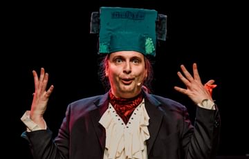 Actor is shown wearing a Frankenstein head piece