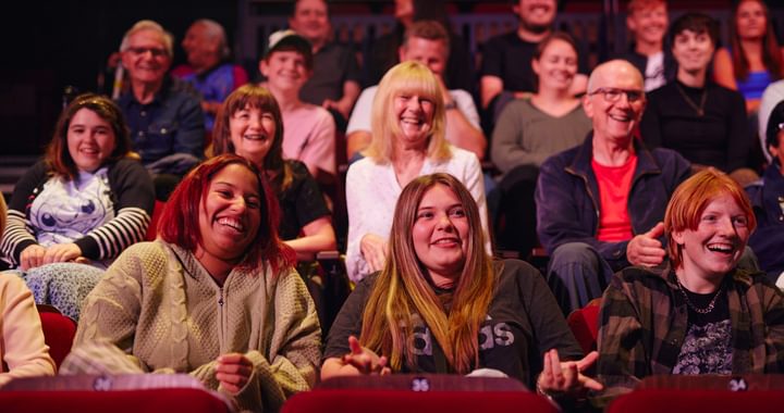 Image of audience sat enjoying a show