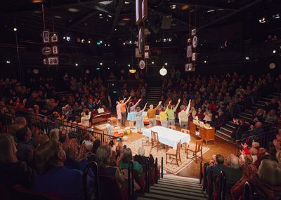 Photo of full audience applauding