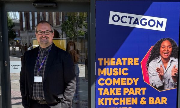 Gareth Redston stood in-front of the entrance to the Octagon Theatre.