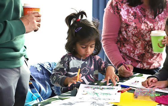 Small child doing Diwali craft