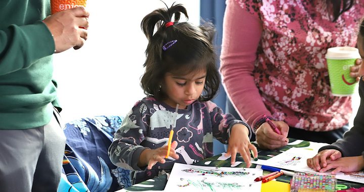 Small child doing Diwali craft