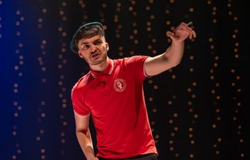 Actor stands on stage looking angry