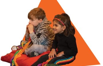 Children sitting and watching a show