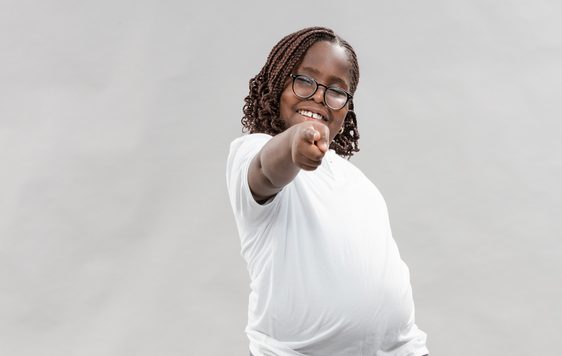 Young person pointing