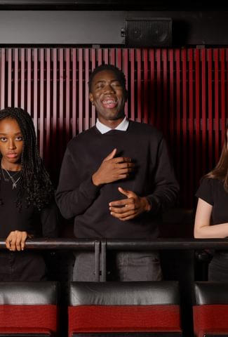 Image of three youth performers posing