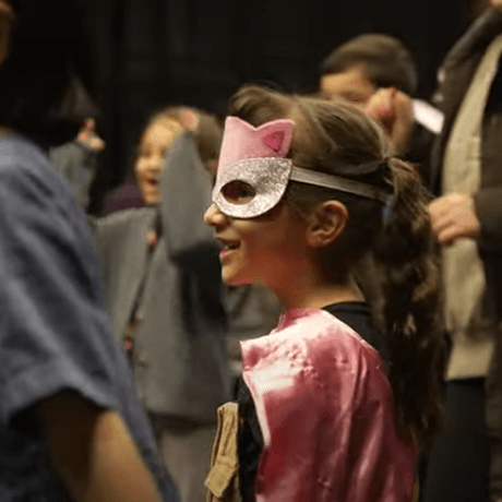 Child in fancy dress mask
