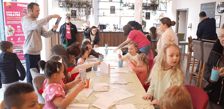 Children and parents doing arts and crafts