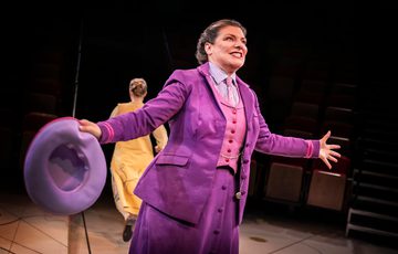 Actor singing on stage