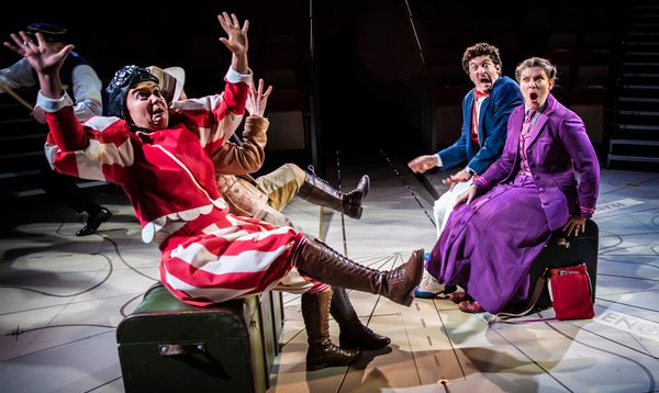 4 people sit on chests looking very shocked!