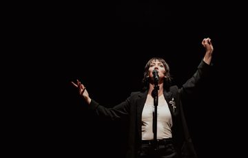 woman speaking at a mic