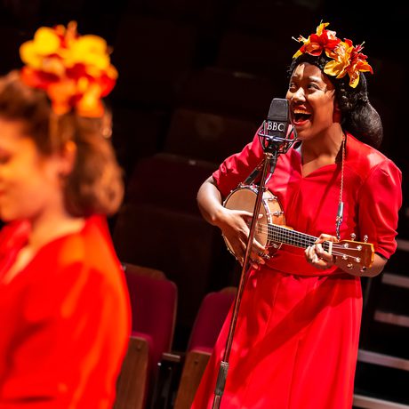 woman playing ukulele