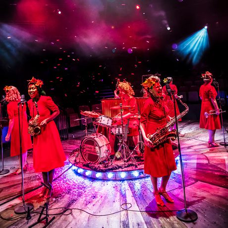 Group of performers playing instruments