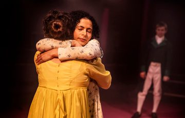 two women hugging tightly