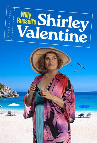 Actor Mina Anwar in a beach outfit with a Greek beach background