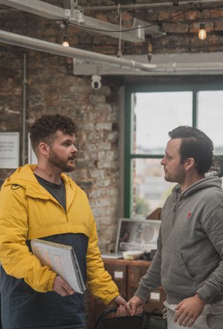 Two men stood chatting