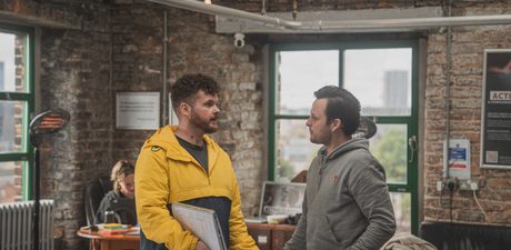 Two men stood chatting