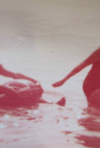 Old photo of a father and daughter in the sea