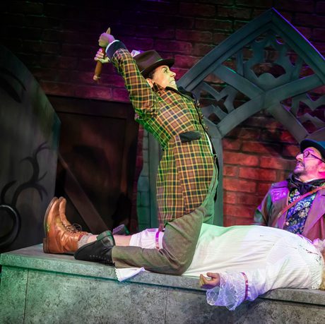 Man staking a dead body on top of a crypt