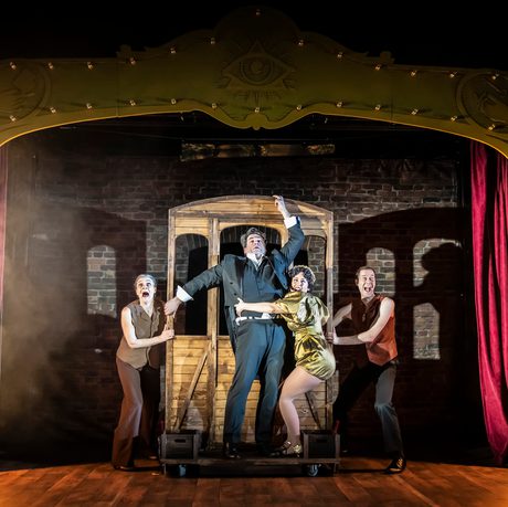 People on stage looking panicked