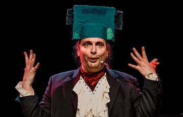 Actor is shown wearing a Frankenstein head piece