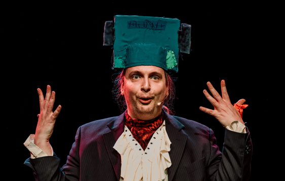 Image shows actor with a Frankenstein inspired head piece on