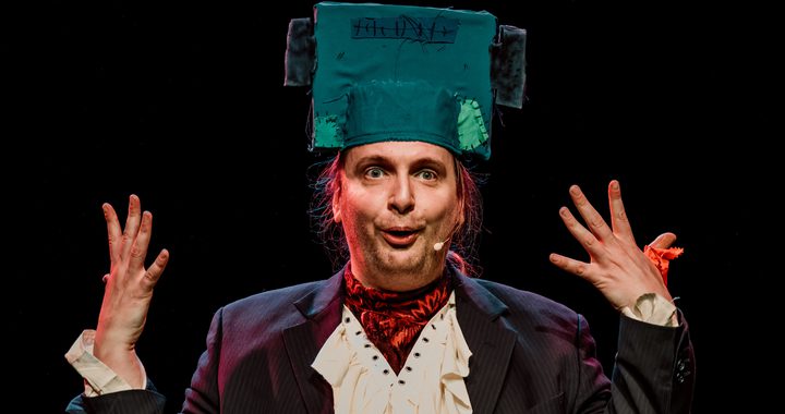 Image shows actor with a Frankenstein inspired head piece on