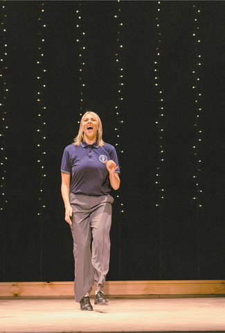 Actors on stage dancing