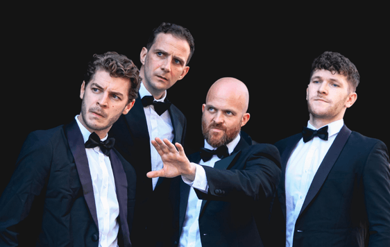 4 men in black tie suits