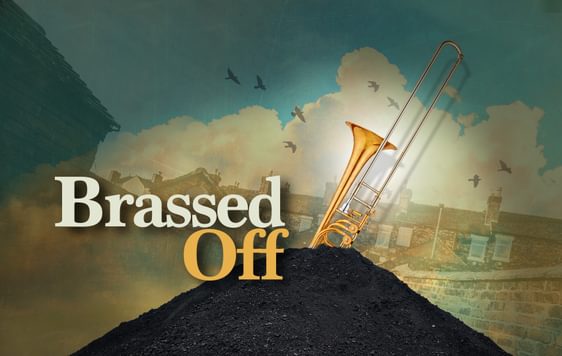 Brassed off title treatment with a trombone in a pile of coal behind it.