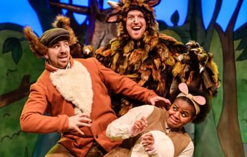 Actors dressed as Gruffalo, Fox and Mouse posing in for a picture