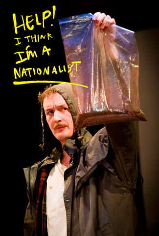 an holding a bag of dirt up