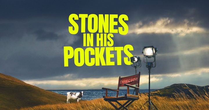 Stones in his pockets title with a director chair in a field and a cow in the background