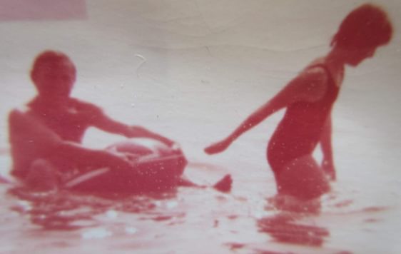 Old photo of a father and daughter in the sea