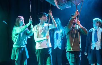 Image of young people performing on stage